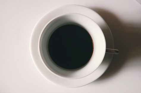 black liquid in white ceramic mug